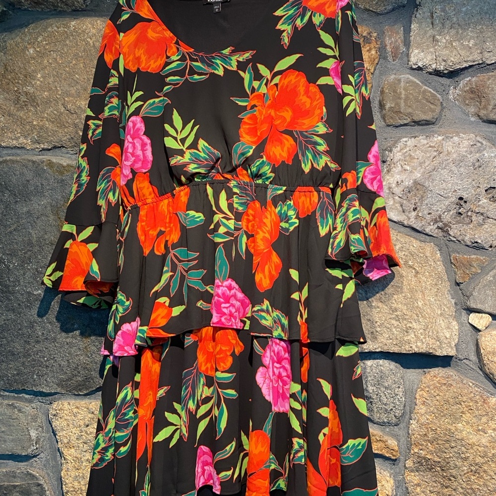 Express rich floral tiered dress with bell-shaped 3/4 length sleeves,
